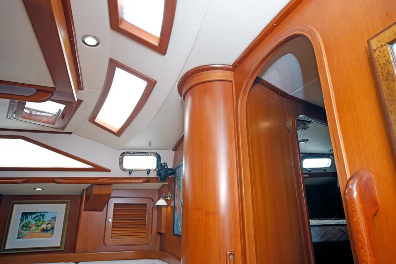 Legacy Yacht Photos Pics Interior of 2012 Hylas 49CC yacht with wooden finishes and skylights.