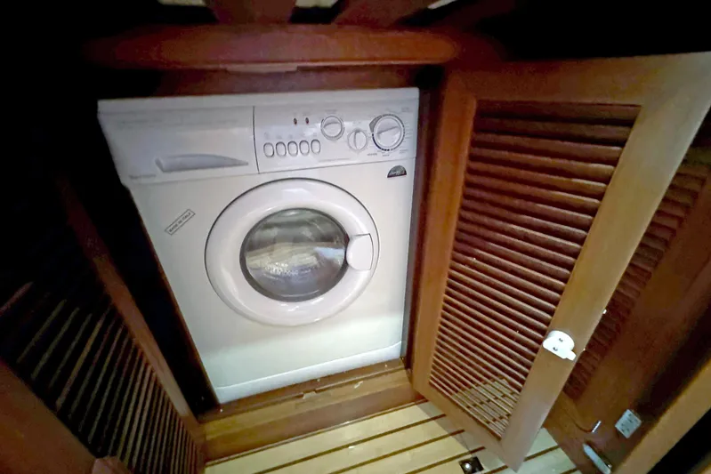 Legacy Yacht Photos Pics Washing machine in wooden cabinet on 2012 Hylas 49CC yacht.