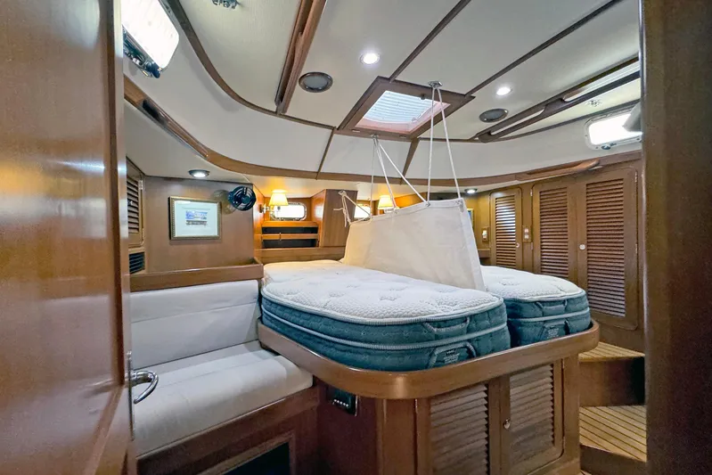 Legacy Yacht Photos Pics Luxurious 2012 Hylas 49CC yacht interior with cozy cabin and elegant wood finishes.
