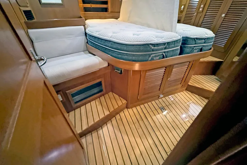 Legacy Yacht Photos Pics Luxurious 2012 Hylas 49CC yacht interior with wooden flooring and comfortable seating.