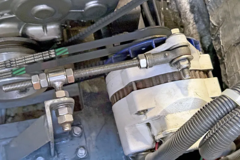 Legacy Yacht Photos Pics Engine components of a 2012 Hylas 49CC with visible belts and wiring.