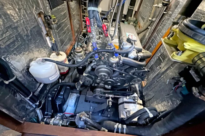 Legacy Yacht Photos Pics Engine compartment of a 2012 Hylas 49CC yacht, showcasing detailed mechanical components.