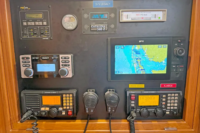 Legacy Yacht Photos Pics Control panel of a 2012 Hylas 49CC yacht with navigation and communication equipment.