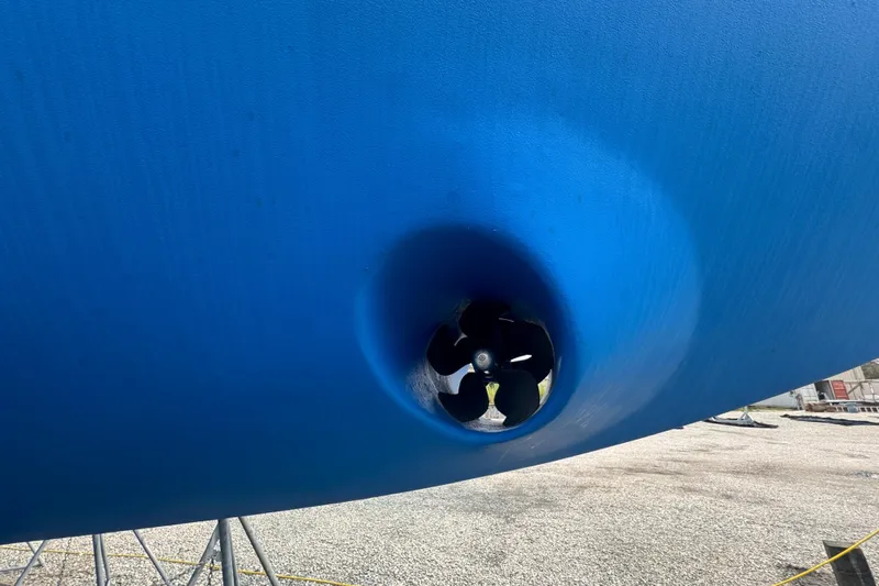 Legacy Yacht Photos Pics Blue hull of 2012 Hylas 49CC sailboat with visible propeller.