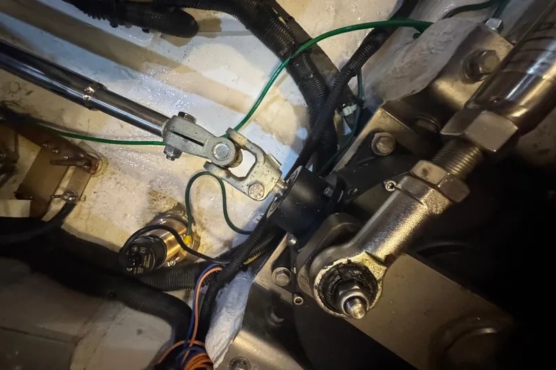 Legacy Yacht Photos Pics Engine compartment of a 2012 Hylas 49CC yacht, showing mechanical components and wiring.