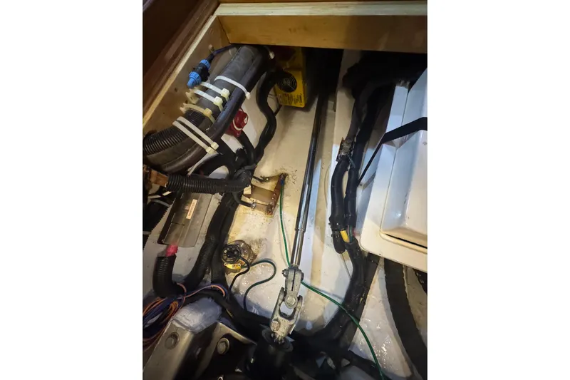 Legacy Yacht Photos Pics Engine compartment of a 2012 Hylas 49CC with visible wiring and components.