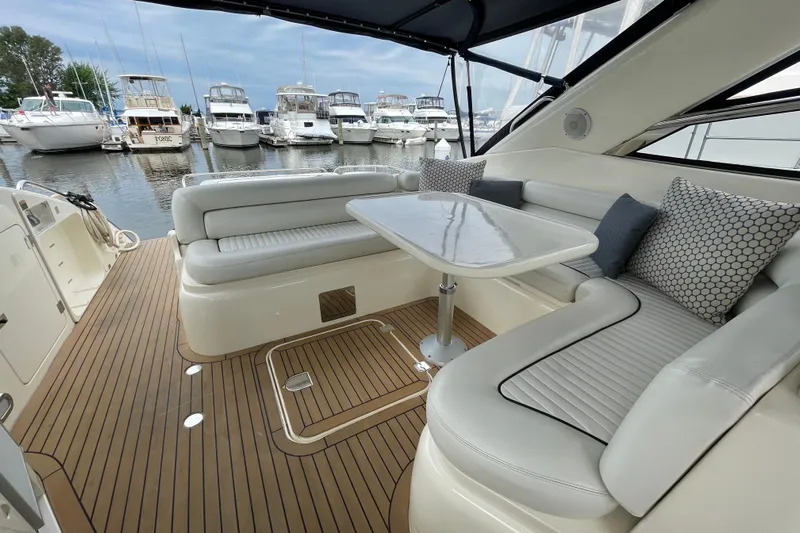 Cover Girl Yacht Photos Pics Luxurious 1997 Sunseeker Camargue 51 yacht interior with elegant seating and table.