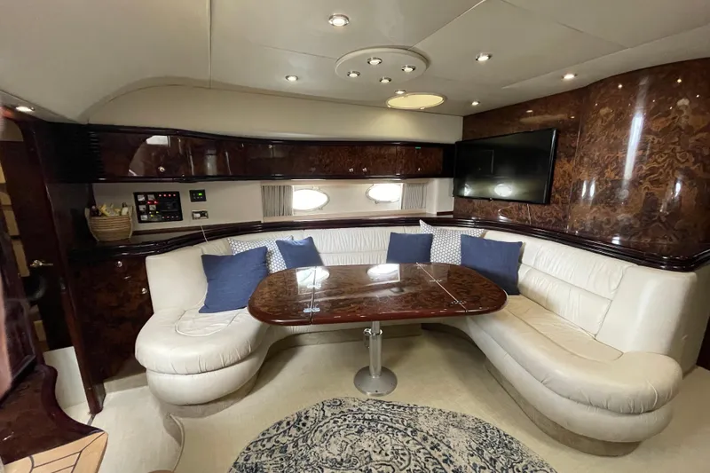 Cover Girl Yacht Photos Pics Luxurious interior of 1997 Sunseeker Camargue 51 yacht with elegant seating and wood finishes.