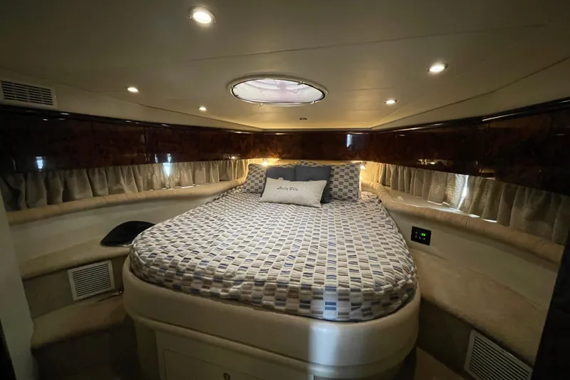 Cover Girl Yacht Photos Pics Luxurious bedroom interior of 1997 Sunseeker Camargue 51 yacht with elegant lighting.