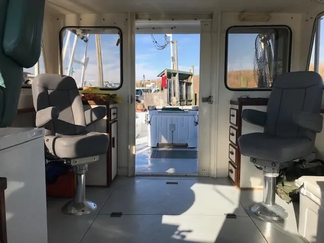 Hey Dad Yacht Photos Pics Interior of a 1999 Provincial 42 Fishing Boat with two swivel chairs.