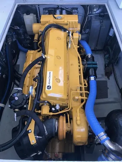 Hey Dad Yacht Photos Pics Engine compartment of a 1999 Provincial 42 Fishing Boat with a yellow marine engine.