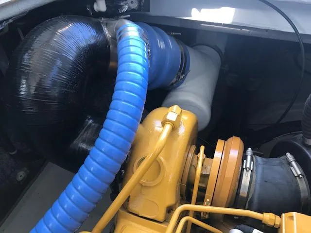 Hey Dad Yacht Photos Pics Engine compartment of a 1999 Provincial 42 Fishing Boat with visible hoses and components.