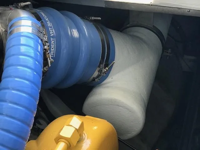 Hey Dad Yacht Photos Pics Engine compartment of 1999 Provincial 42 Fishing Boat with blue silicone hoses.