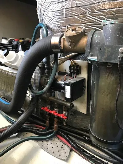 Hey Dad Yacht Photos Pics Engine room of 1999 Provincial 42 Fishing Boat with mechanical components and hoses.