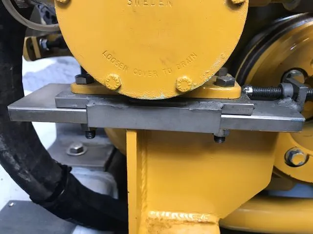 Hey Dad Yacht Photos Pics Yellow engine component on a 1999 Provincial 42 Fishing Boat, featuring metal brackets and bolts.