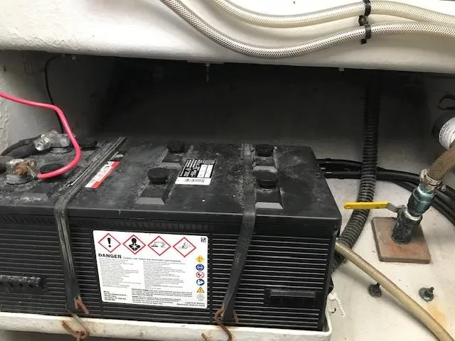 Hey Dad Yacht Photos Pics Battery compartment of a 1999 Provincial 42 Fishing Boat, showing wiring and safety labels.