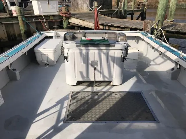 Hey Dad Yacht Photos Pics 1999 Provincial 42 Fishing Boat deck with storage and equipment, docked at a marina.