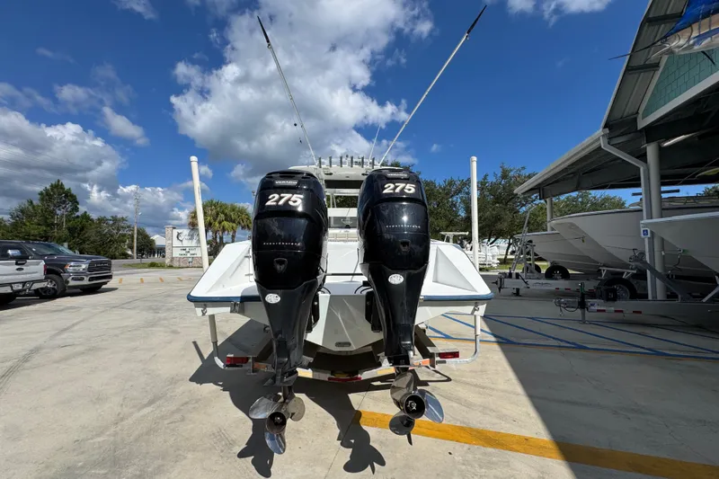  Yacht Photos Pics 2007 Venture 34 Open boat with twin 275 horsepower engines, parked outdoors under a clear sky.