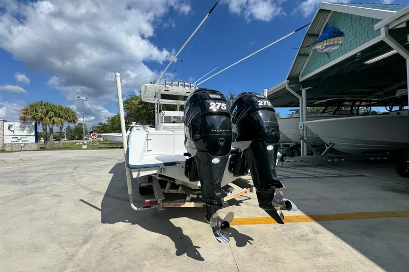  Yacht Photos Pics 2007 Venture 34 Open boat with twin 275 horsepower engines, parked outdoors under a blue sky.