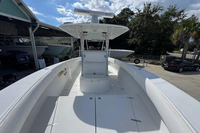  Yacht Photos Pics 2007 Venture 34 Open boat with Garmin radar, docked under clear skies.