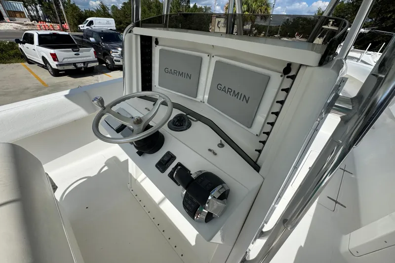  Yacht Photos Pics 2007 Venture 34 Open boat helm with Garmin displays and steering wheel.