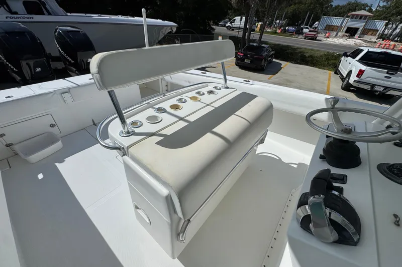  Yacht Photos Pics 2007 Venture 34 Open boat helm with seating and steering wheel in a parking lot setting.