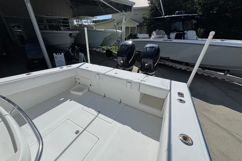  Yacht Photos Pics 2007 Venture 34 Open boat with dual Mercury engines in a marina setting.