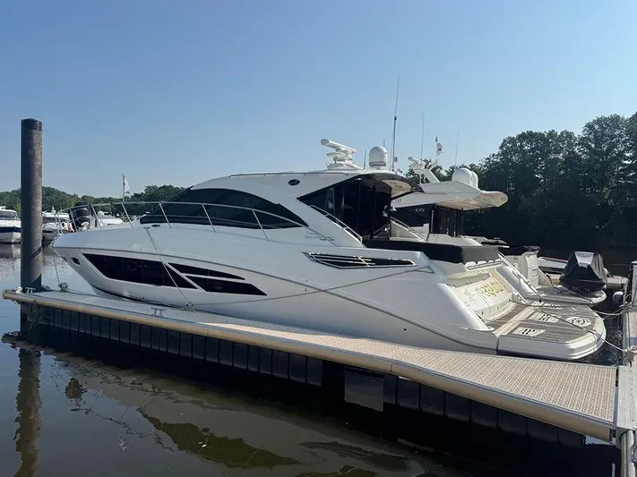  Yacht Photos Pics 2015 Sea Ray 510 Sundancer yacht docked at marina, side view.
