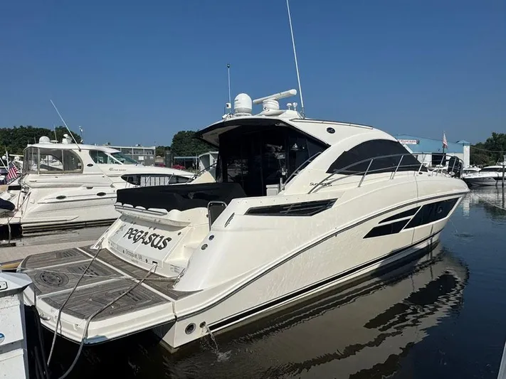  Yacht Photos Pics 2015 Sea Ray 510 Sundancer yacht docked at marina, sunny day.