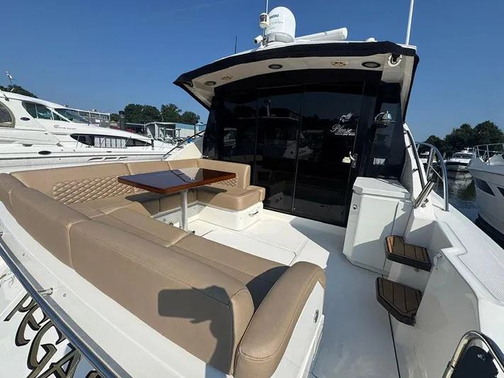  Yacht Photos Pics 2015 Sea Ray 510 Sundancer yacht with spacious outdoor seating and table.