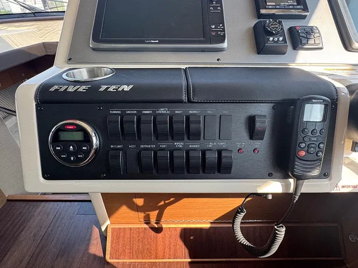  Yacht Photos Pics Control panel of a 2015 Sea Ray 510 Sundancer yacht with various switches and devices.