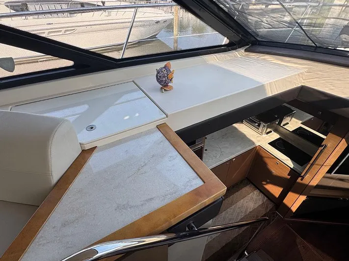  Yacht Photos Pics Interior of 2015 Sea Ray 510 Sundancer yacht with modern kitchen and seating area.