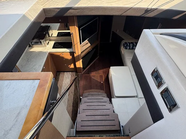  Yacht Photos Pics Interior of 2015 Sea Ray 510 Sundancer yacht, featuring modern kitchen and seating area.