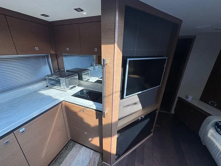  Yacht Photos Pics Luxurious interior of 2015 Sea Ray 510 Sundancer yacht with modern kitchen and entertainment area.