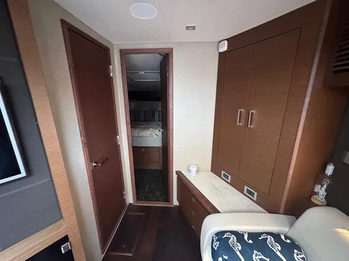  Yacht Photos Pics Interior of 2015 Sea Ray 510 Sundancer yacht, featuring wood cabinetry and cozy seating.