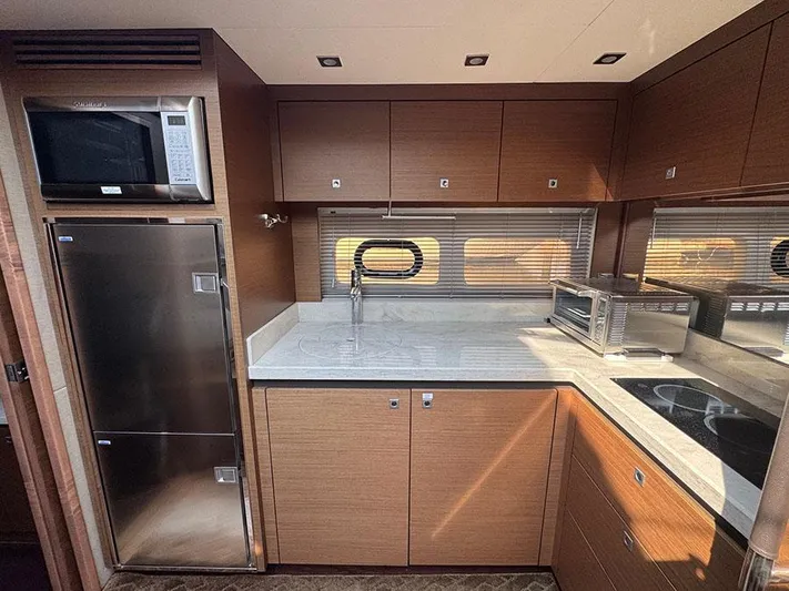  Yacht Photos Pics Luxurious kitchen interior of 2015 Sea Ray 510 Sundancer yacht with modern appliances.