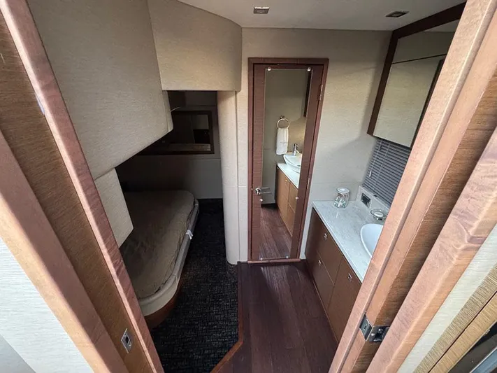  Yacht Photos Pics 2015 Sea Ray 510 Sundancer interior with bedroom and bathroom, featuring modern design and wood finishes.