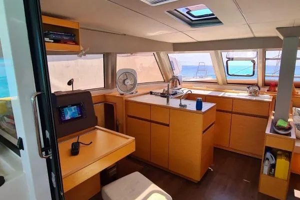 Kaikira Yacht Photos Pics Interior of 2019 Nautitech 46 catamaran with modern kitchen and navigation area.