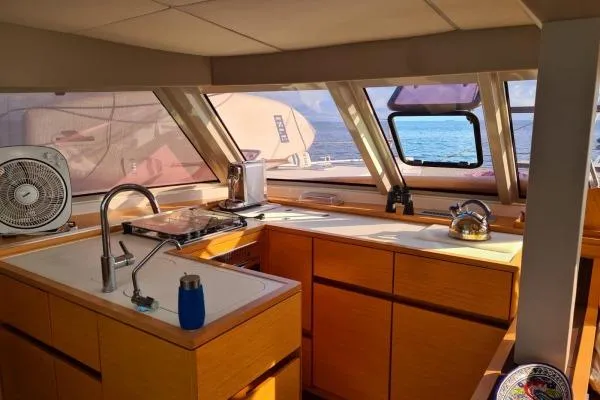 Kaikira Yacht Photos Pics Modern kitchen interior of 2019 Nautitech 46 catamaran with ocean view.