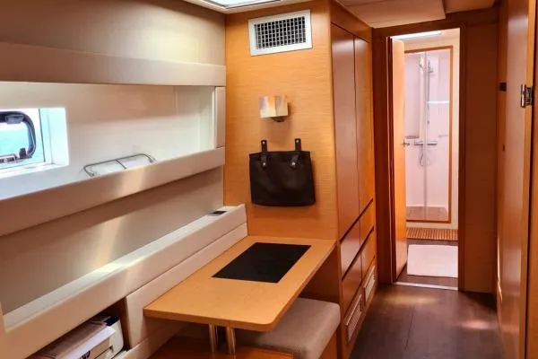 Kaikira Yacht Photos Pics Interior of 2019 Nautitech 46 catamaran featuring a compact workspace and modern bathroom.