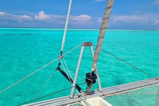Kaikira Yacht Photos Pics Nautitech 46 catamaran sailing on clear turquoise waters, 2019 model.
