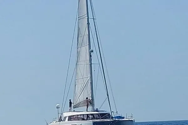 Kaikira Yacht Photos Pics 2019 Nautitech 46 catamaran sailing on open sea under clear blue sky.