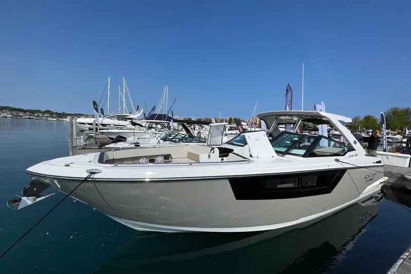 Livin Life Yacht Photos Pics 2023 Monterey 378SS Super Sport boat docked at marina under clear blue sky.