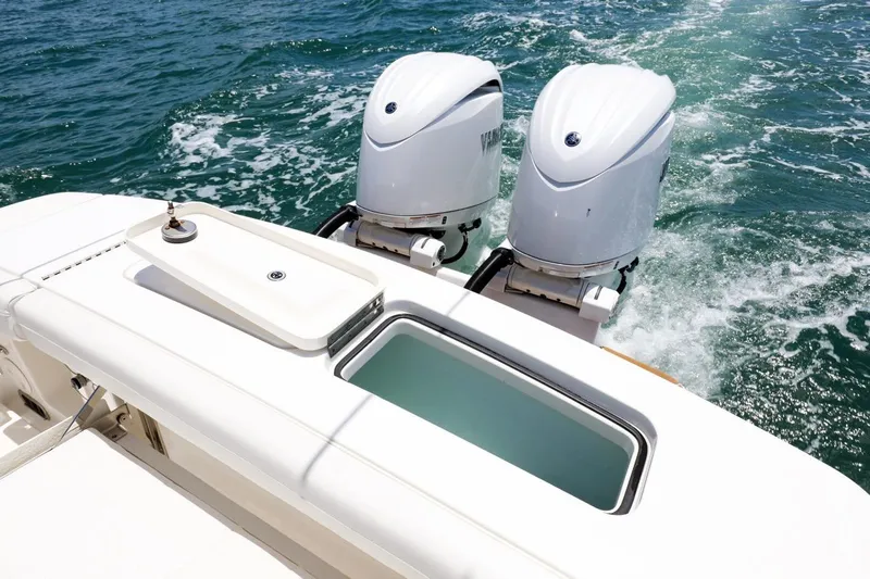  Yacht Photos Pics 2024 Regulator 23 boat with dual engines on open water.