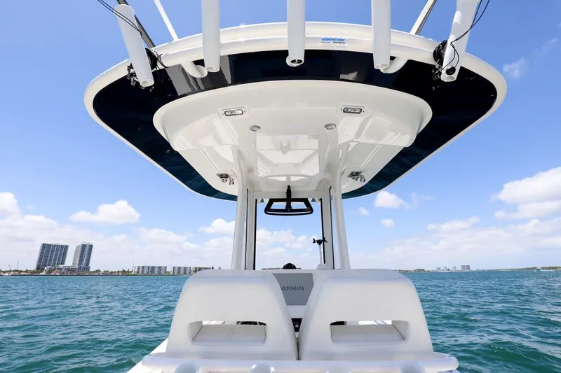  Yacht Photos Pics 2024 Regulator 23 boat on water, featuring sleek design and modern amenities.