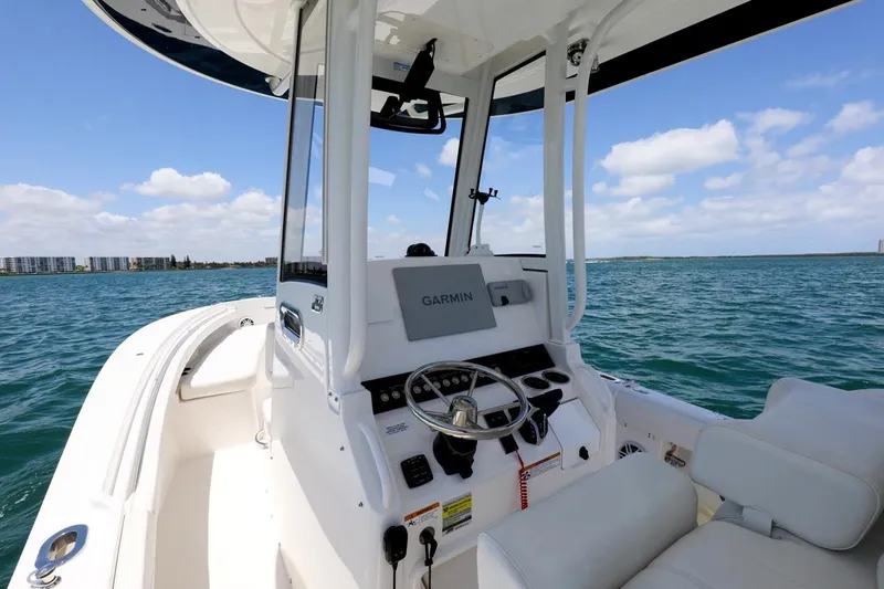  Yacht Photos Pics 2024 Regulator 23 boat console with Garmin system on open water.