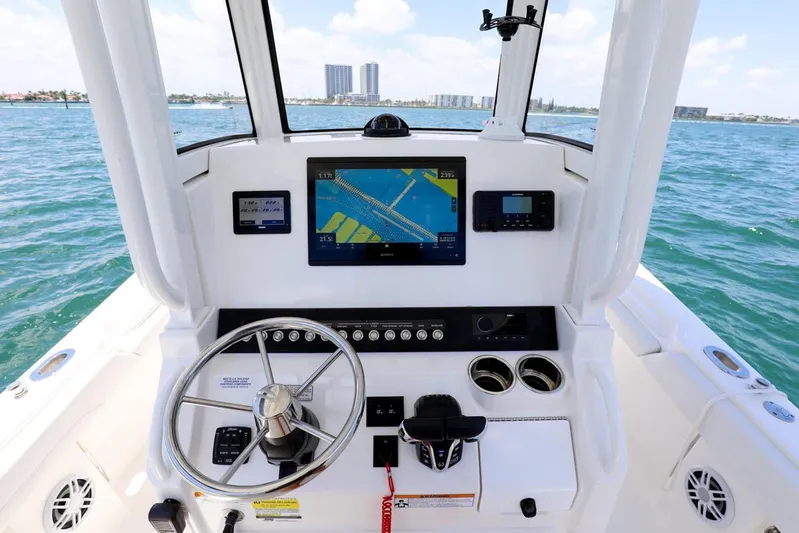  Yacht Photos Pics 2024 Regulator 23 boat dashboard with navigation system on open water.