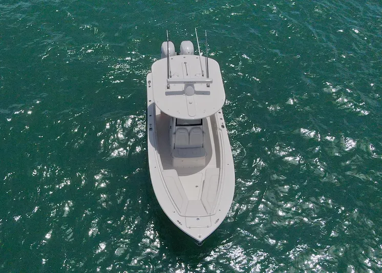  Yacht Photos Pics 2024 Regulator 23 boat on clear blue water, aerial view.