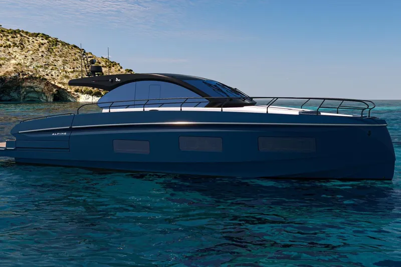  Yacht Photos Pics 2026 Beneteau Gran Turismo 50 yacht on clear blue water near rocky coastline.