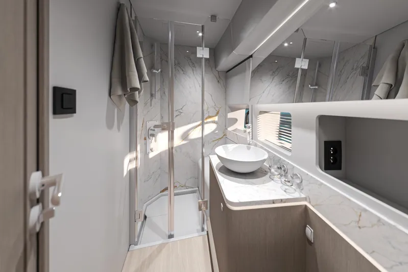  Yacht Photos Pics Luxurious bathroom in 2026 Beneteau Gran Turismo 50 yacht with modern fixtures and marble accents.